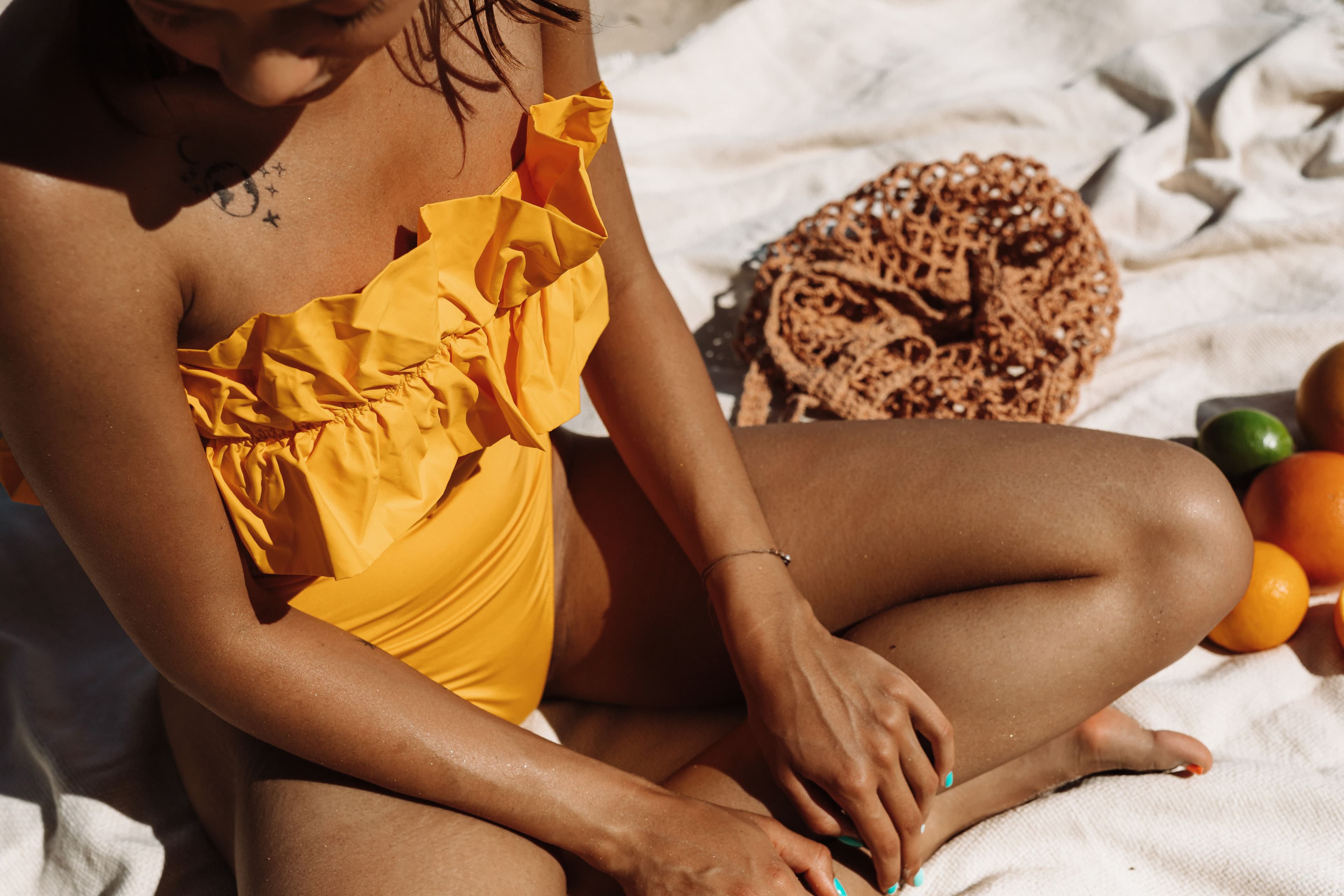 Ruffle one-piece swimsuit detail for swimwear sampling and prototype review